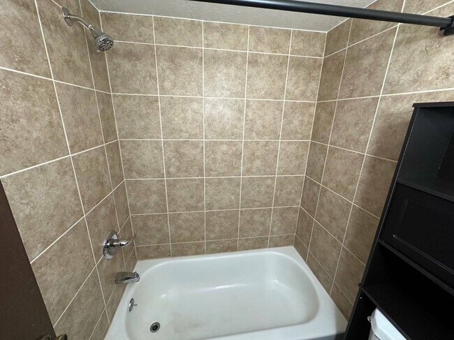 Experience relaxation in this elegantly designed bathroom, perfect for unwinding. - Country Club