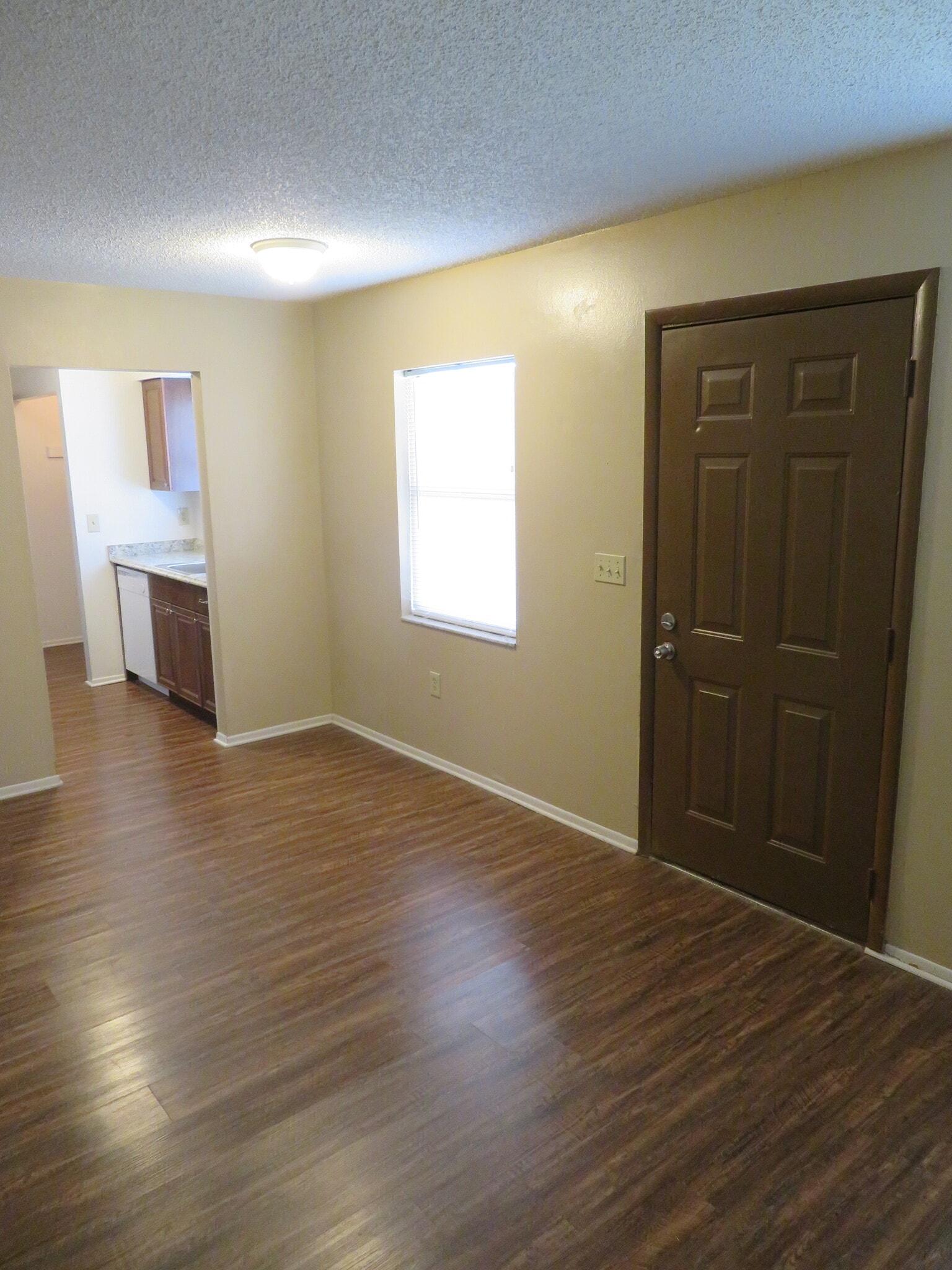 Living room / dining area to kitchen - 2418 S San Gully Rd