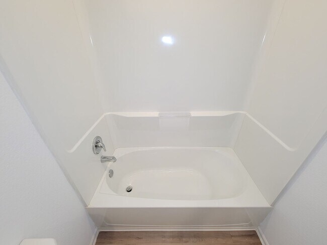 Building Photo - This single-story home has a comfortable layout with three bedrooms and a living area all on one ...