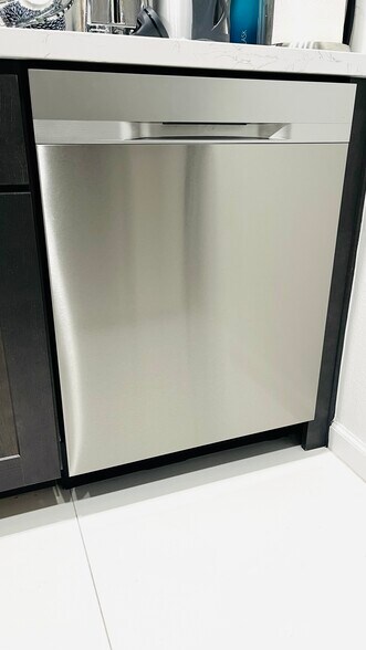 New kitchen with stainless steel refrigerator, dishwasher, stove with built-in air fryer, microwave - 6600 Warner Ave