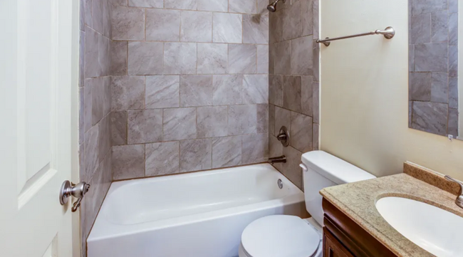 Bathroom with Marble Tile Surround - 703 E Oak St