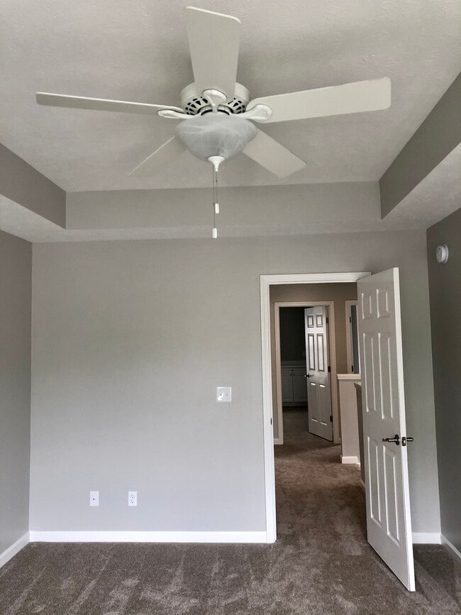 vaulted ceiling and fan in master bedroom - 230 Heritage Ln