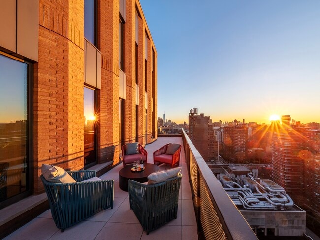 Elevate your lifestyle at Ruby Chelsea, where modern elegance meets stunning sunset views. Enjoy our spacious terraces designed for relaxation and gatherings. Don't miss the opportunity to call this exceptional community home—schedule your tour today! - Ruby Apartments