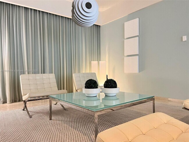 Building Photo - 10275 Collins Ave