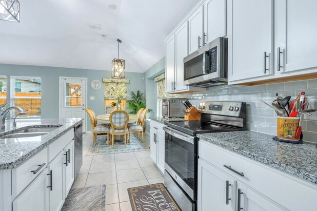 Building Photo - **Stunning 4BR/3BA Home with Dual Primary Ensuites & Modern Upgrades!**