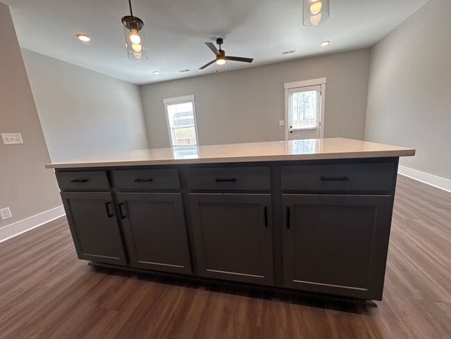 Building Photo - “Stylish 3BR End-Unit | Open Concept | Quartz Kitchen | Garage + Deck