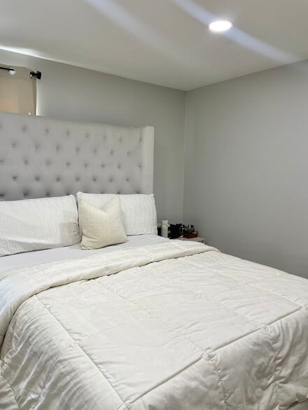 Spacious bedroom fitting a king sized bed + 2 night stands on each end - 100 Lakeview Ave