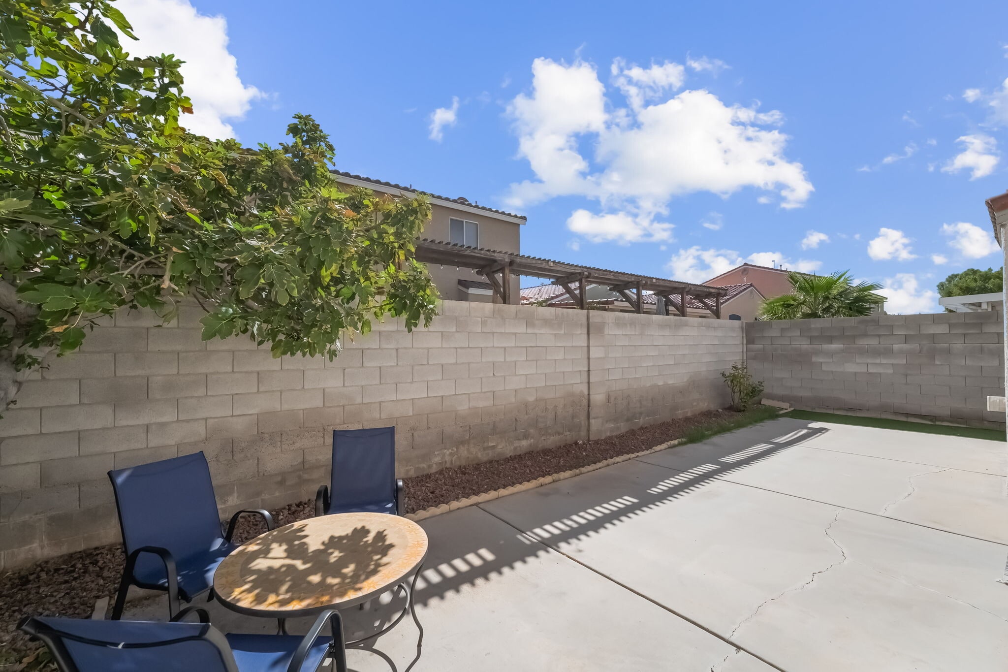 Fenced backyard featuring a patio - 1179 Antoinette St