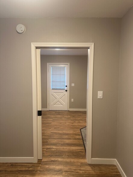 Looking at front door from small bedroom - 707 NE Holly St