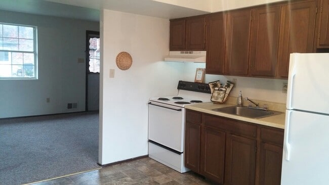Kitchens come equipped with stove and refrigerator. - Parkridge Dr