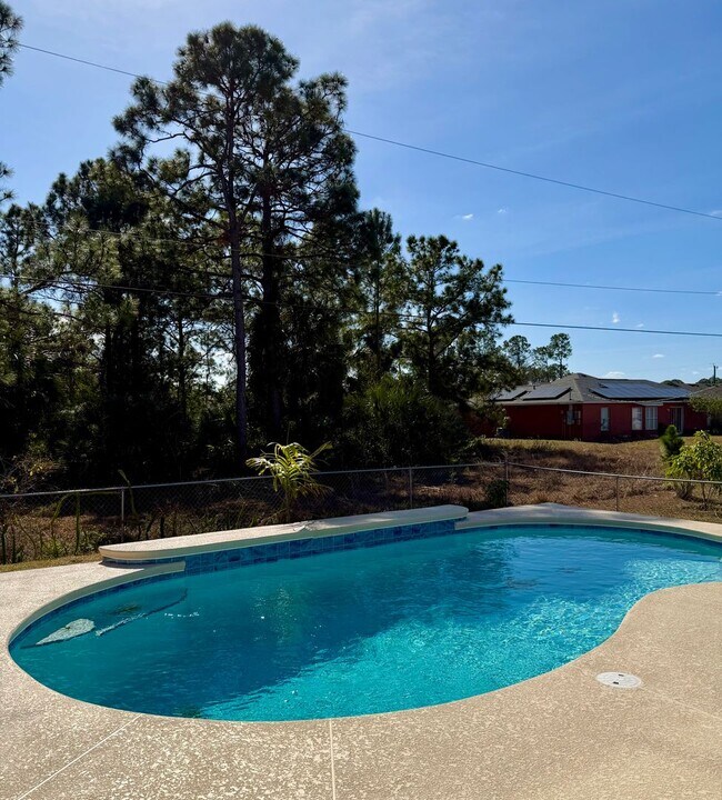 Building Photo - Palm Bay Pool Home Stunner!