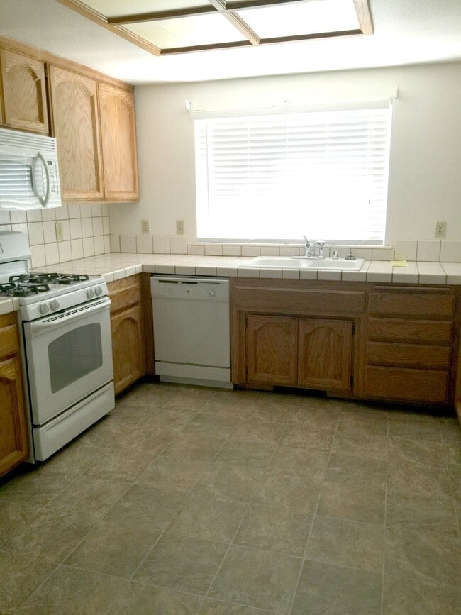 Building Photo - Spacious 3-Bedroom Home with Greenbelt Views & Landscaping Included