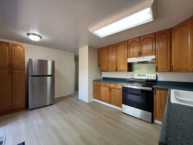 Building Photo - Charming Ranch Home with Sunroom or 4th Bedroom, Two-Car Garage and Fenced Backyard