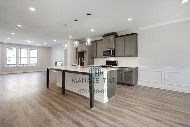 Building Photo - Modern 3-level Townhome featuring 4 bedrooms and 3 1/2 baths