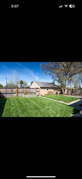 Fully fenced and gated back yard with new sod - 520 S Wilbur Ave
