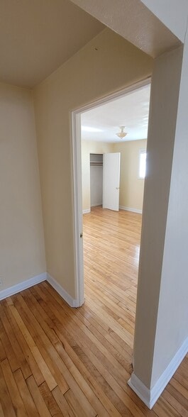 View from upstairs hallway into upstairs bedroom. - 814 Atchison Ave