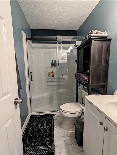 Updated bathroom with large shower and towel warmer - 6028 Dalton Rd