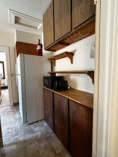 Kitchen, appliance counter and cabinets with shelves above and below. - 2615 Parker St