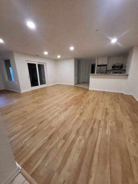 Dining and Living Room Looking at Sliders to Enclosed Porch - 30 Hearthstone Ct