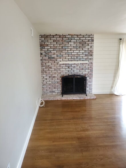 living room fireplace from front entryway - 8608 Harrison Way
