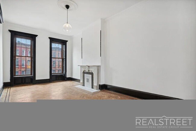 Building Photo - Timelessly Renovated Historic Triplex with...