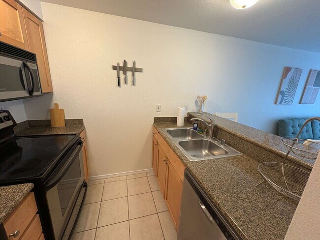 Building Photo - Bright, Modern 1BR Near Hospitals, SU & Transit in secure building with garage parking and a Walk...