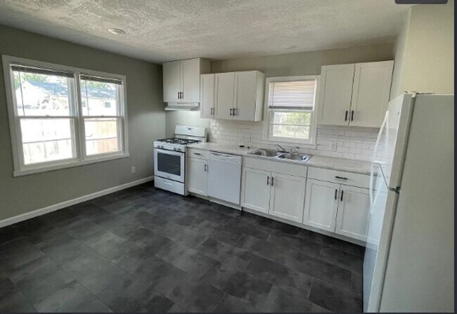 Building Photo - Welcome to Your Next Home with Harvest Investments!