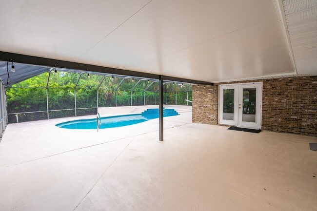 Building Photo - Executive Four-Bedroom Pool Home