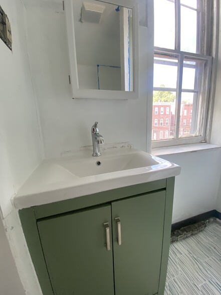 Unit 2 renovated bathroom - 217 Hamilton Ave