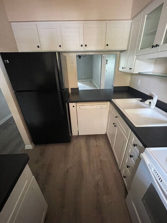 Building Photo - 55+ Charming first-floor condo nestled in ...