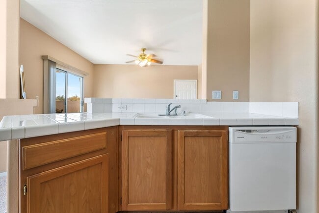 Building Photo - Bright & Stylish Condo with Fireplace and Private Balcony in a Resort-Style Community!