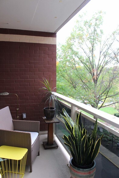 Balcony view through foliage - 7333 New Hampshire Ave