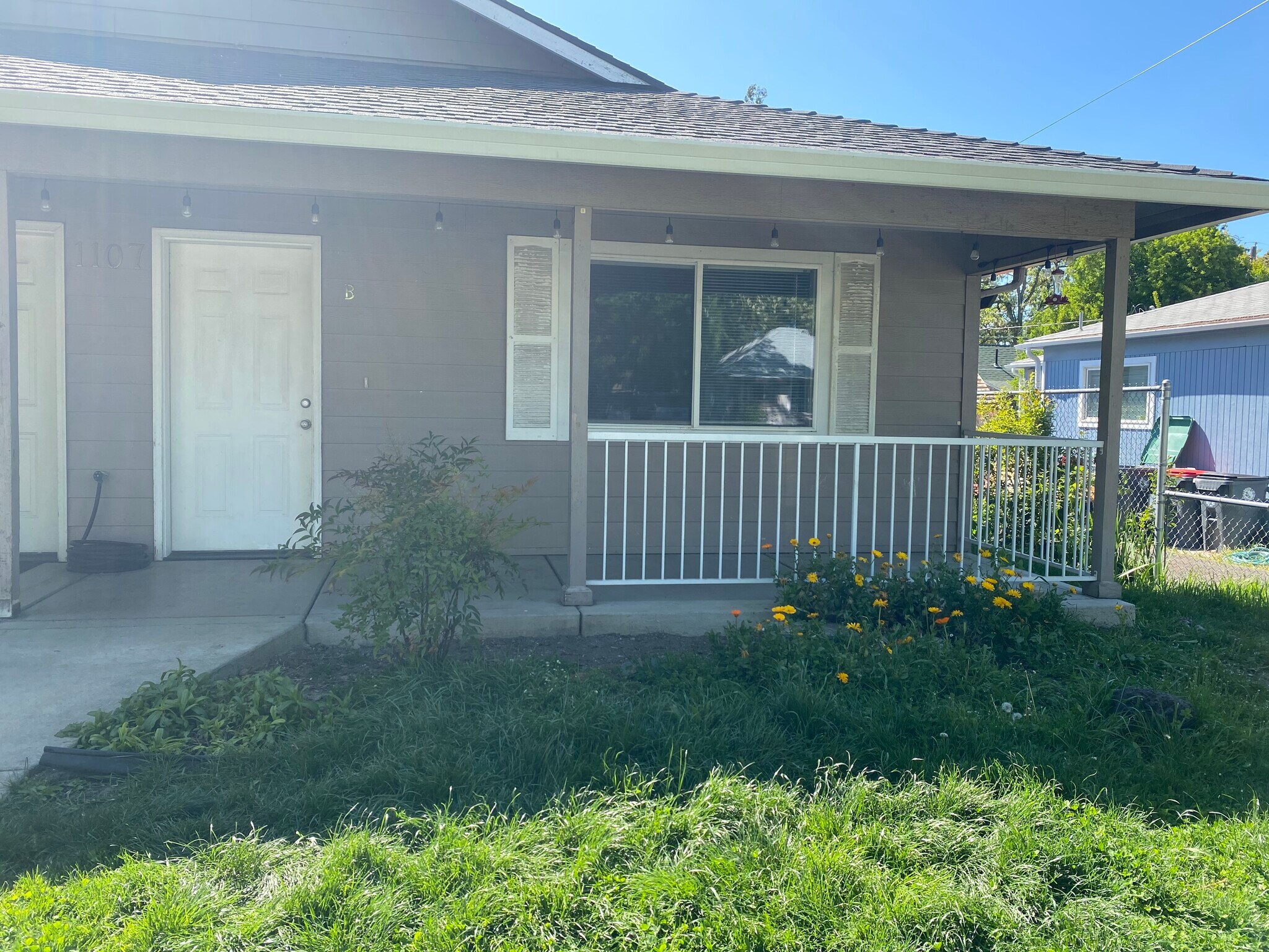 Front porch and gated yard - 1107 Niantic St