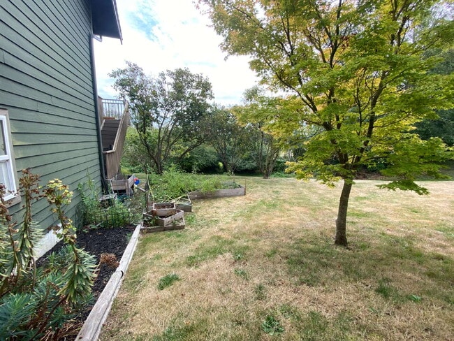 Building Photo - Spacious 4-bedroom with Panoramic Deck Nex...