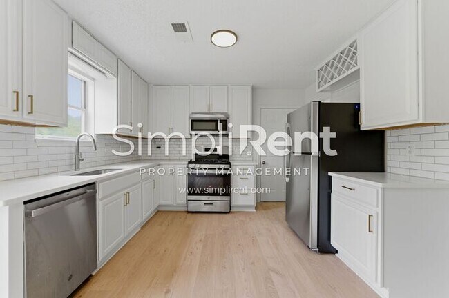 Building Photo - Updated Home with Spacious Layout & Private Backyard