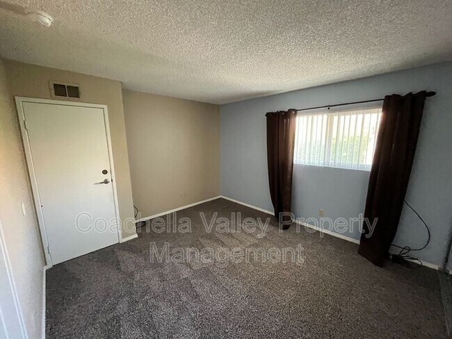 Building Photo - 1950 S Palm Canyon Dr