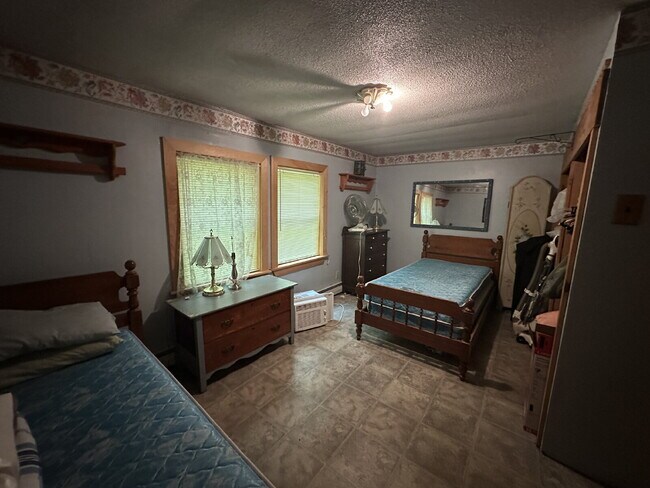 Building Photo - Charming 3BR Waterfront Retreat with Sunroom, Brick Accent & Scenic Lake Views