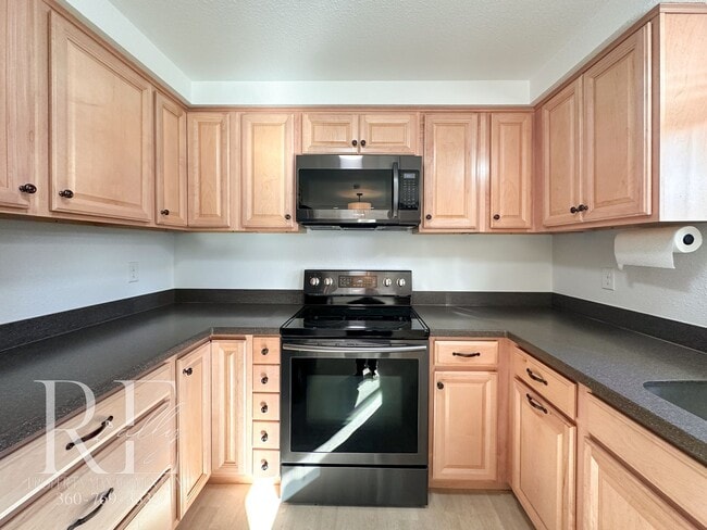 Building Photo - A Warm & Welcoming Rambler in the Heart of Central Kitsap