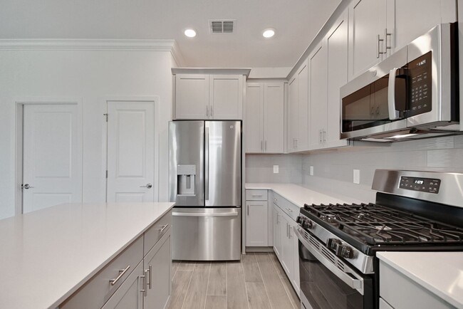 Building Photo - Stunning 4/3 in Gated Dora Parc! Water Views!