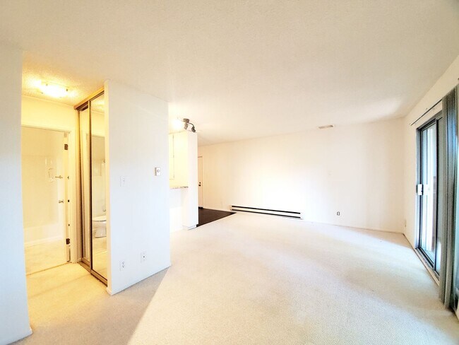 Building Photo - Top floor studio with large patio & greenb...