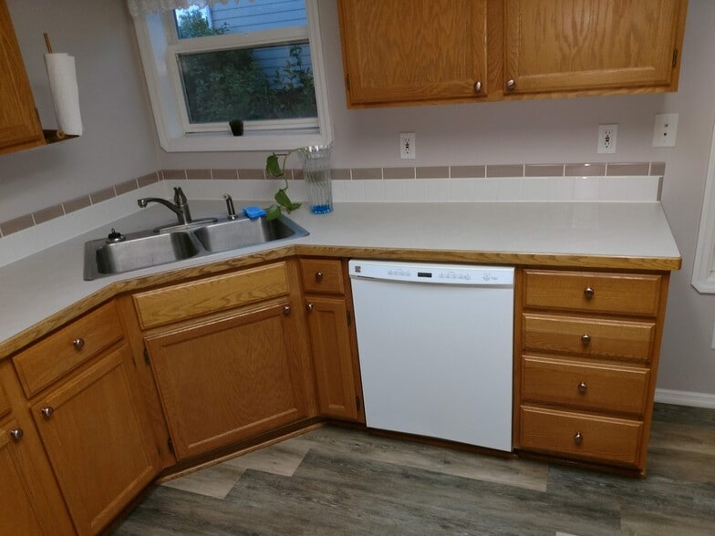 Kitchen double-sink, and the dishwasher. - 310 N Sweetgrass Ave