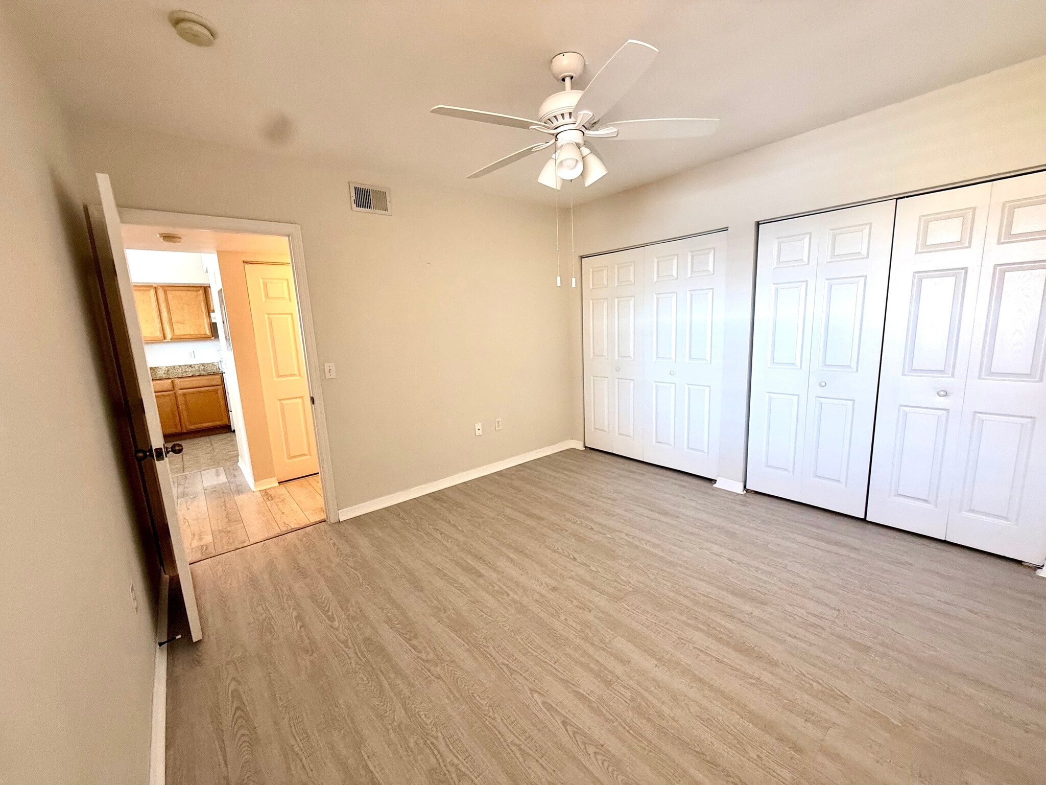 Guest bedroom is nicely appointed with ample closets & view of lake - 1025 Villagio Cir