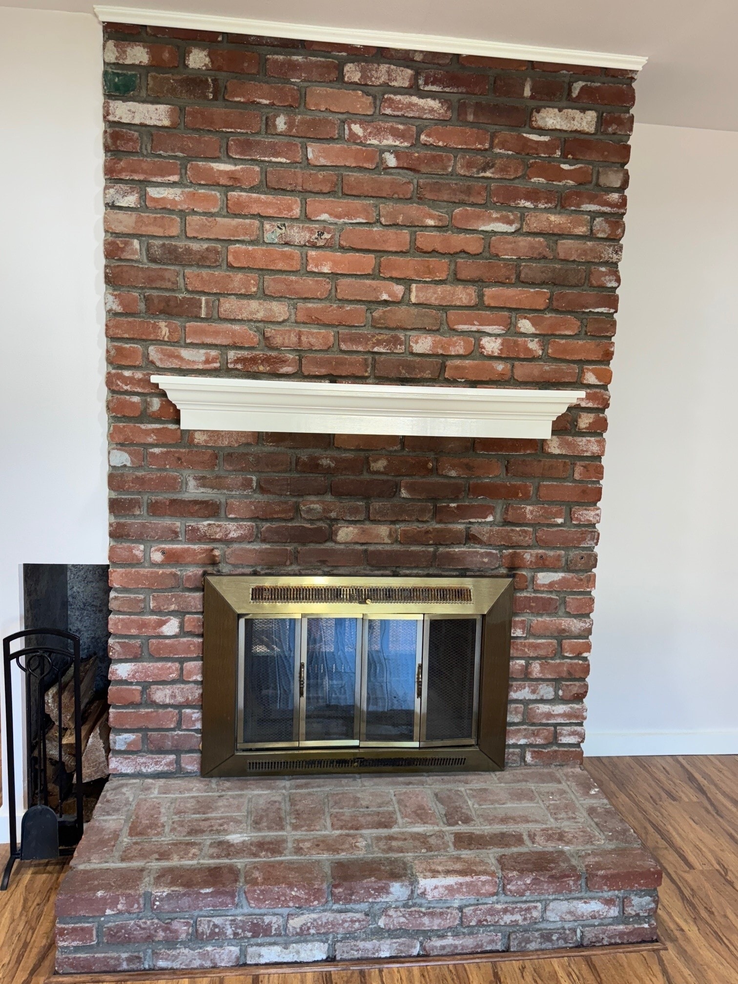 Double sided fireplace. Living room side with wood storage. - 22471 Loch Lomond Dr