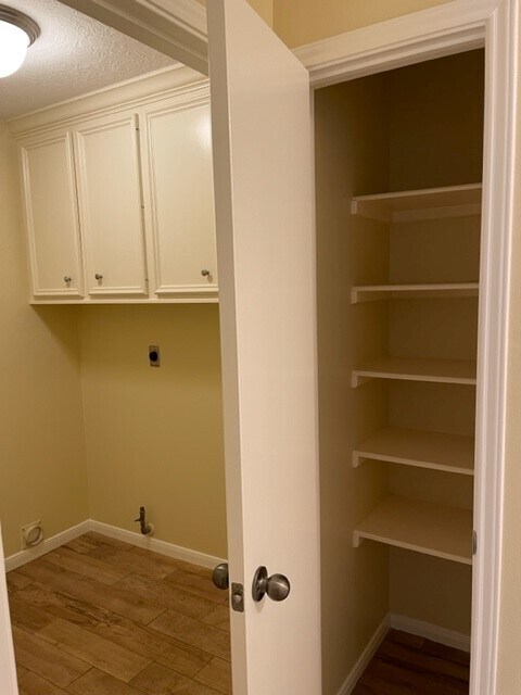 linen closet and laundry with cabinets - 29015 Waltham St