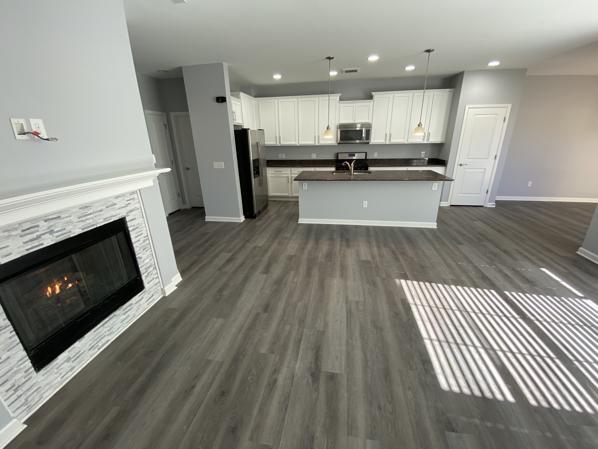 Family room view with gas fireplace - 16155 W 62nd Ln