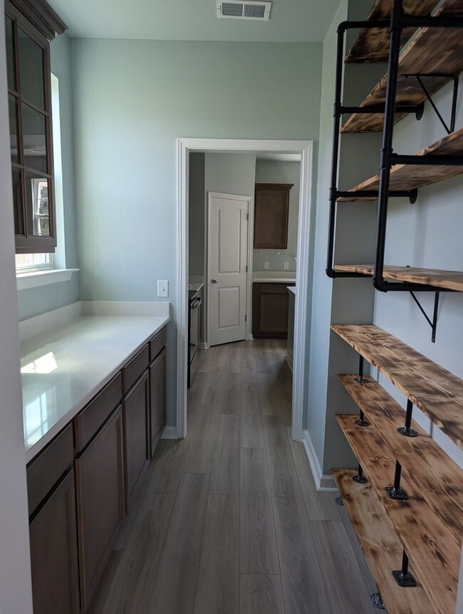 Building Photo - Spacious 4BR / 2.5BA home in a gated commu...