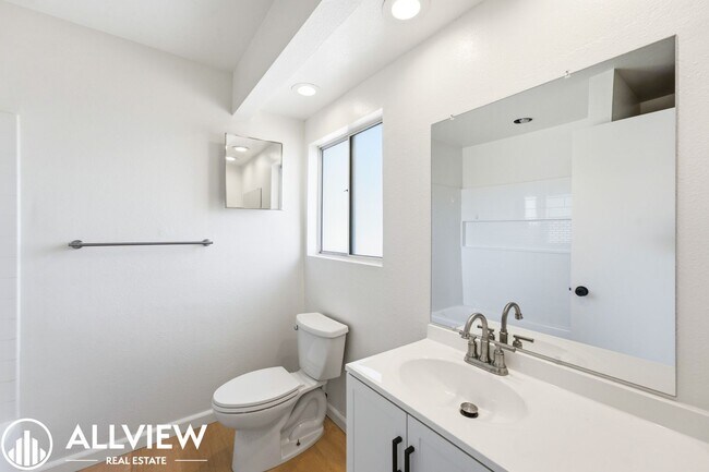 Building Photo - Fully Renovated 2 Bed Townhome with Private Patio, 2-Car Garage & Community Pool
