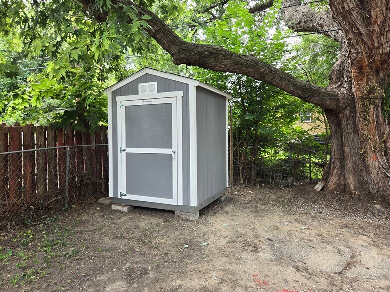Locked storage with mower - 5640 Paseo Blvd