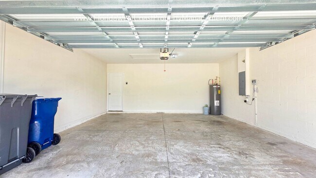 Building Photo - MOVE IN READY ! 4 BEDROOM/2 BATH! TILE- LVP THROUGHOUT! LAWN MOWING INCLUDED!
