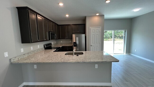 Building Photo - Smart & Stylish 3BD/2BA Palm Bay Home – Modern Upgrades, No Water Bills!